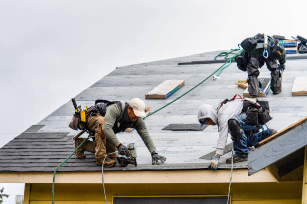 Professional Roofing technician working in East Canaan, CT